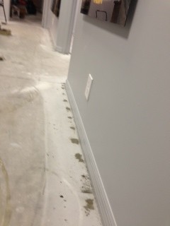 Patching The Concrete Floor Where The Tack Strip For The Carpet